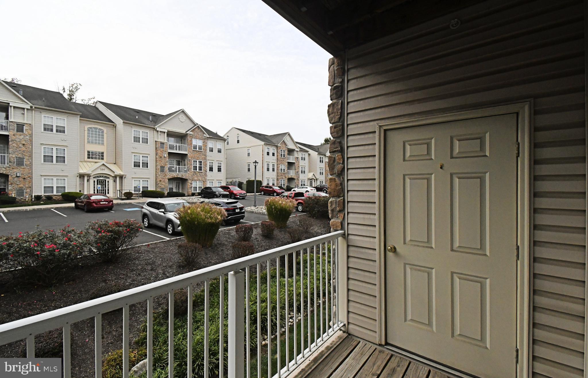 100 Ginko Street, Unit 202 Warrington, PA 18976 - Photo 50 of 53 a view of a balcony and car parked