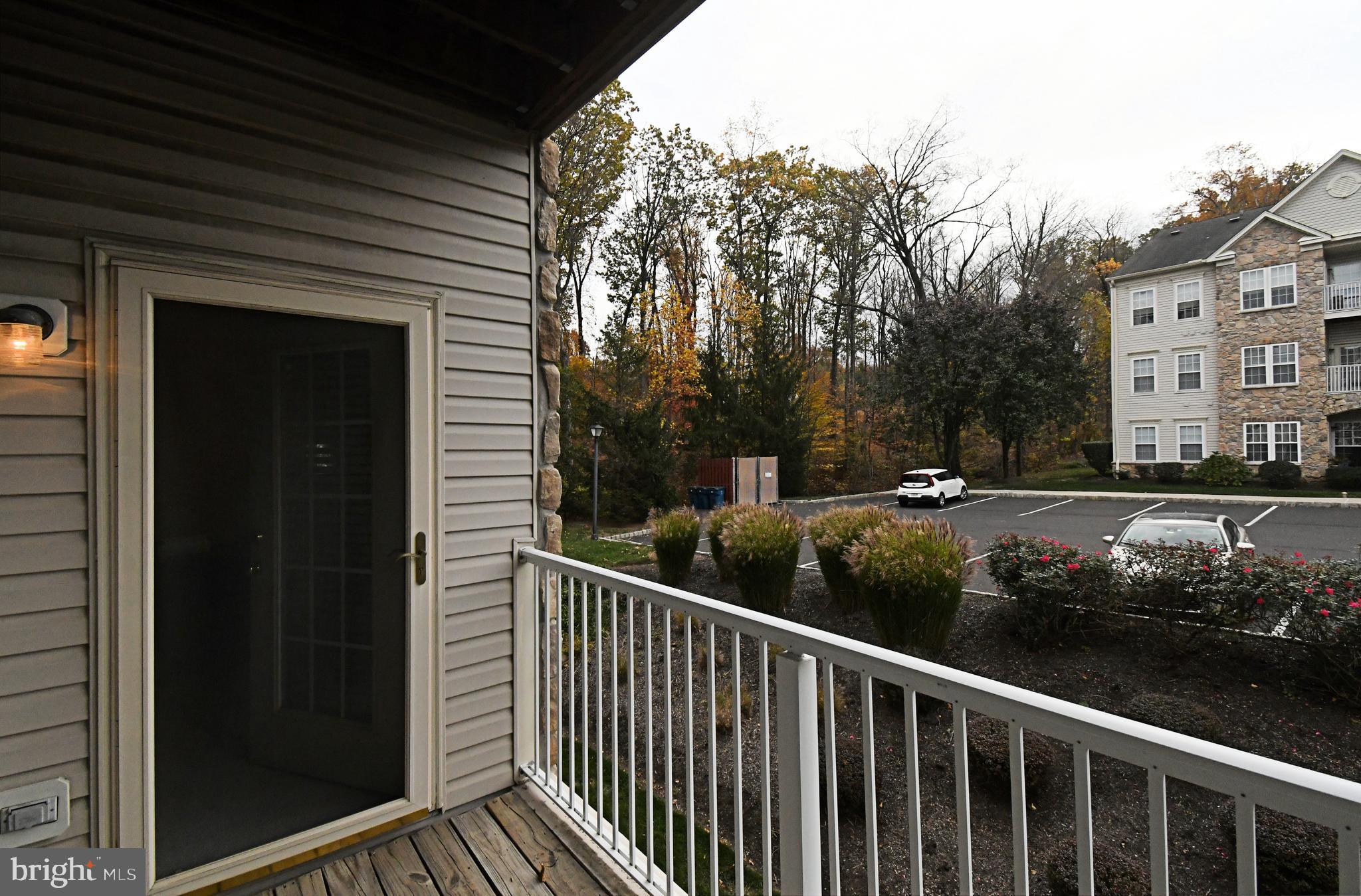 100 Ginko Street, Unit 202 Warrington, PA 18976 - Photo 51 of 53 a view of a balcony with a bench
