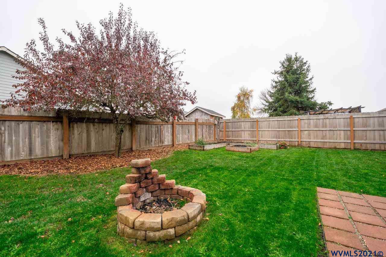 1206 Briar Road Independence, OR 97351 - Photo 34 of 38 a view of a backyard with a fountain plants and large tree