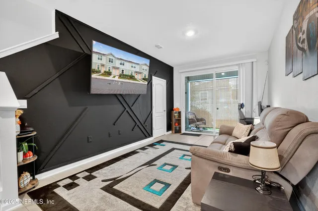 a room with furniture and a flat screen tv