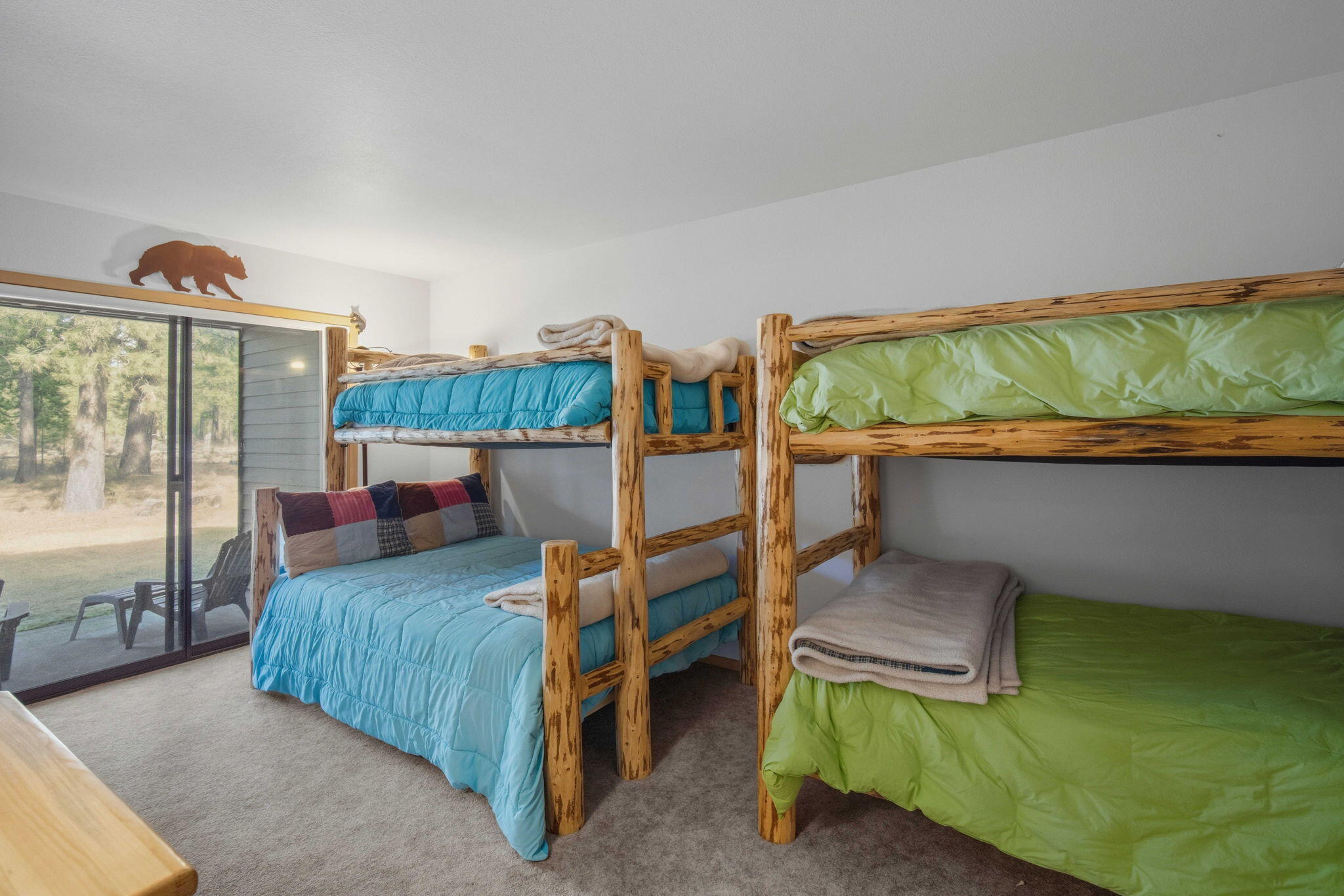 17682 Bittern Lane, Unit 31 Sunriver, OR 97707 - Photo 33 of 44 a bedroom with a bed and a balcony view