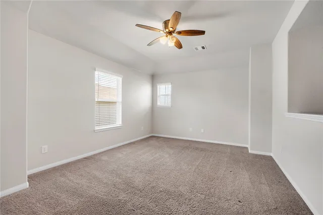 a view of a balcony with yard