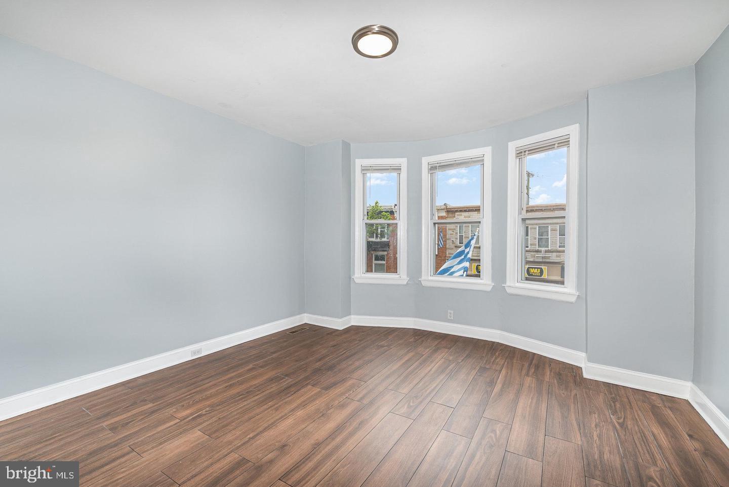 4600 Eastern Avenue Baltimore, MD 21224 - Photo 13 of 25 an empty room with wooden floor and windows