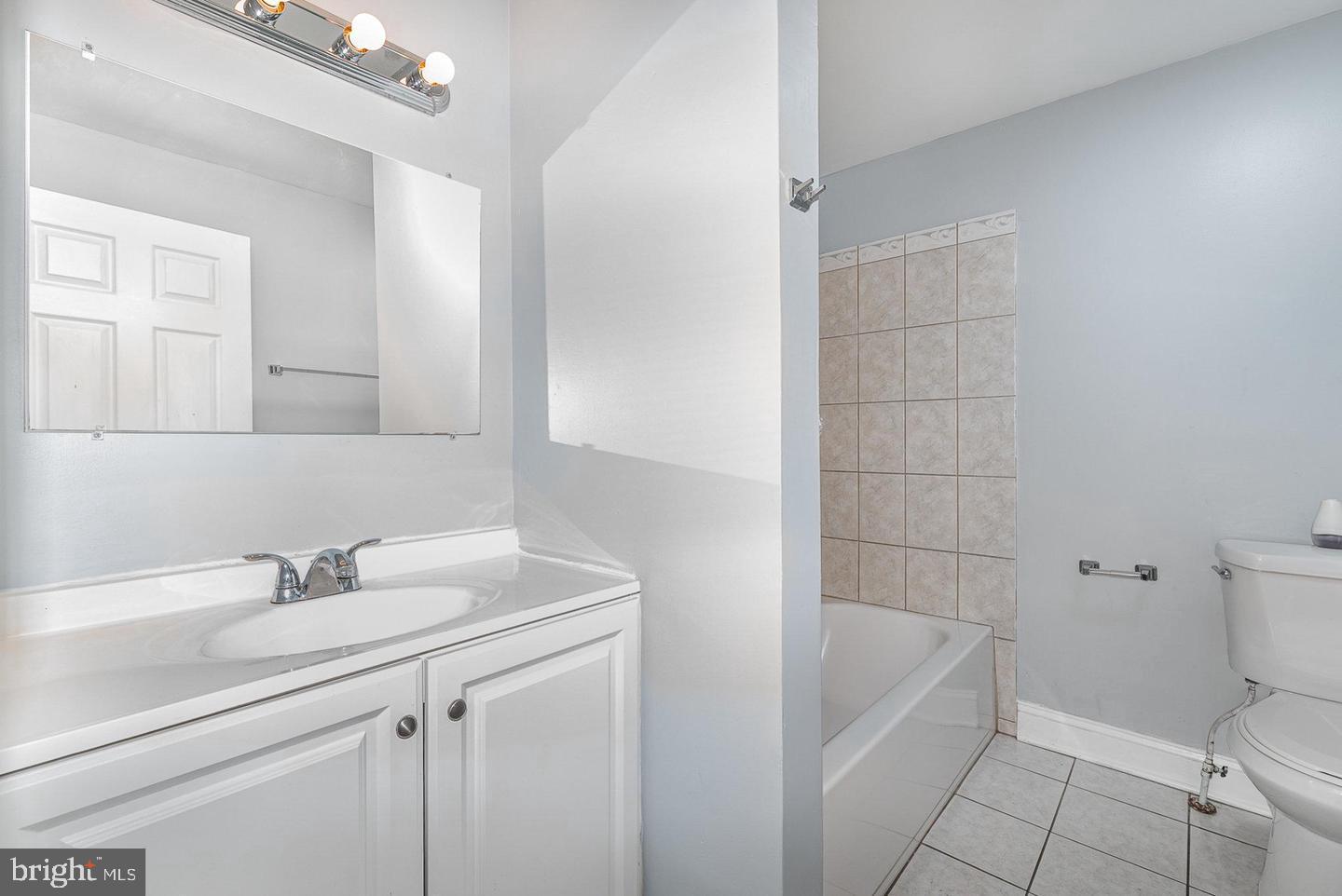 4600 Eastern Avenue Baltimore, MD 21224 - Photo 17 of 25 a bathroom with a sink a toilet and shower