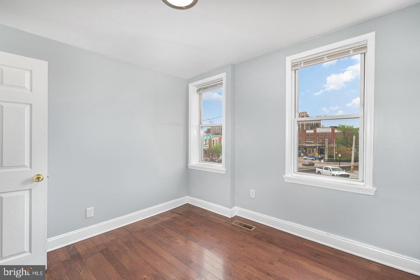 4600 Eastern Avenue Baltimore, MD 21224 - Photo 21 of 25 a view of an empty room with wooden floor and a window