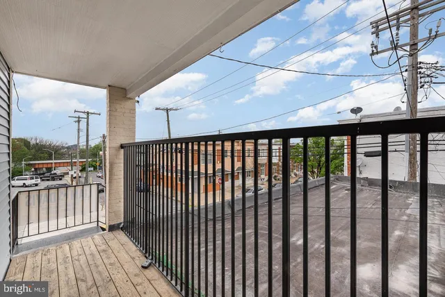 a view of a balcony with wooden floor