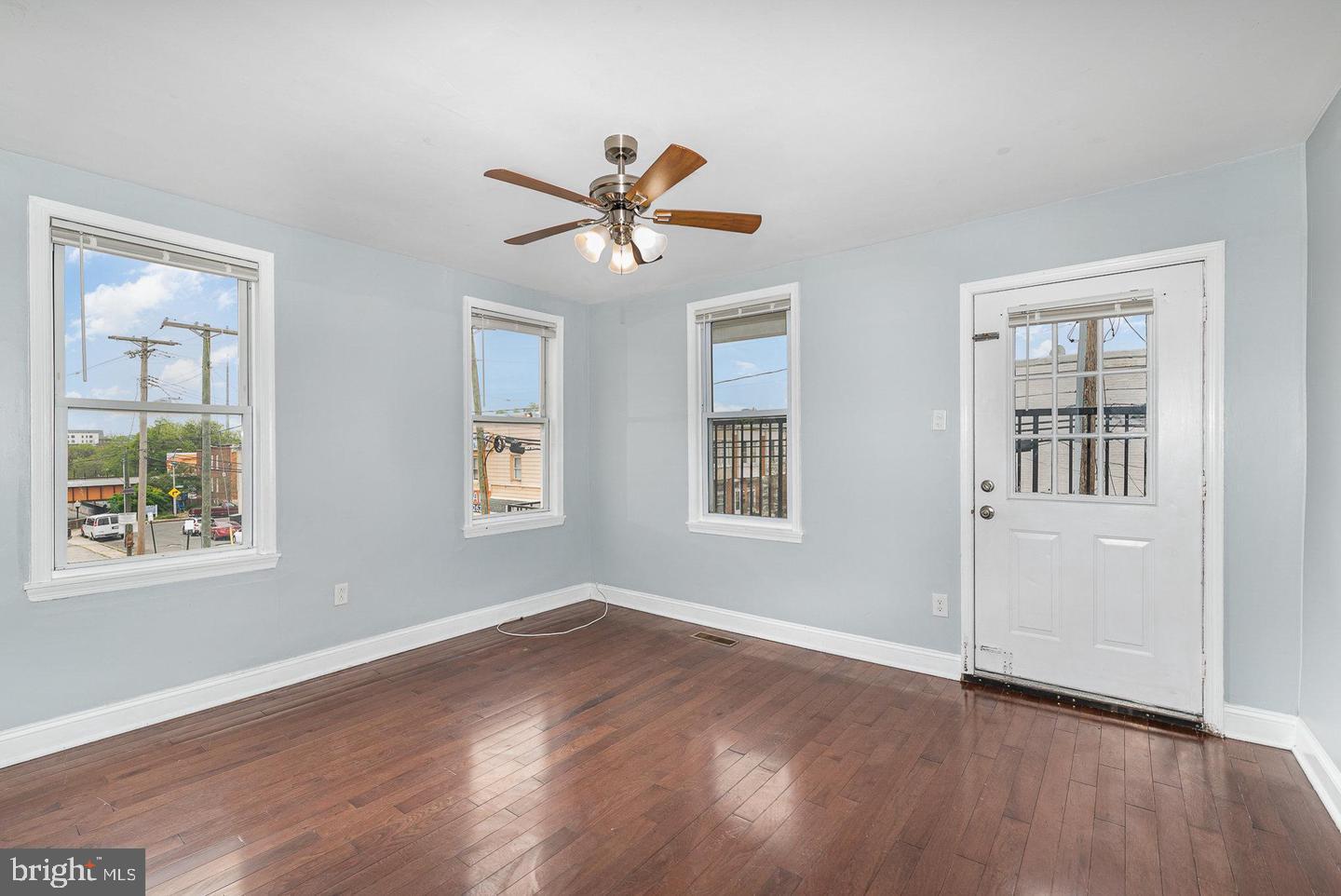 4600 Eastern Avenue Baltimore, MD 21224 - Photo 4 of 25 a view of empty room with wooden floor and fan