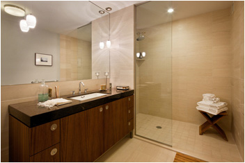 a bathroom with a sink double vanity and a shower