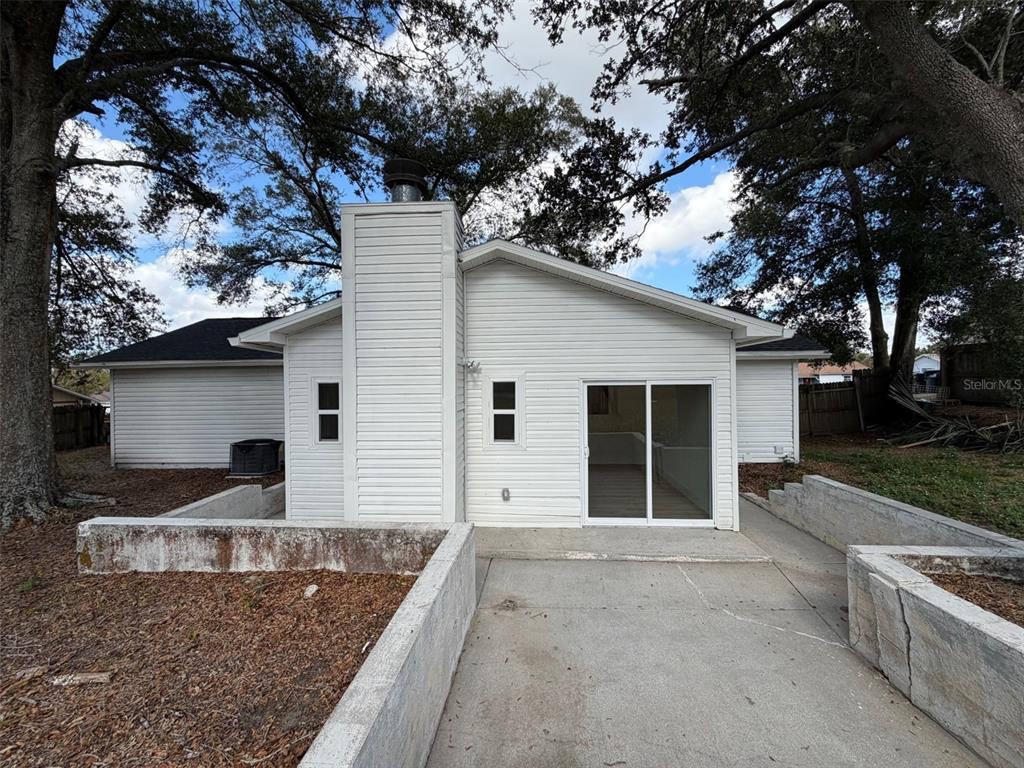 5342 Broken Pine Circle Orlando, FL 32818 - Photo 14 of 15 a front view of a house with garden