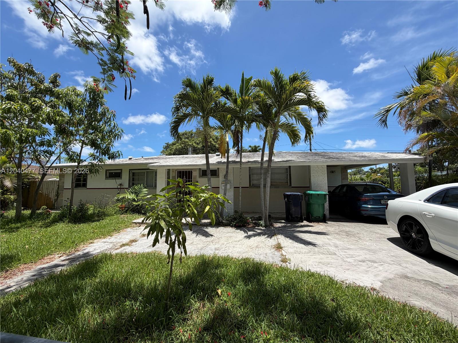 9110 Southwest 44th Street Miami, FL 33165 - Photo 2 of 18 a view of a house with yard and sitting area