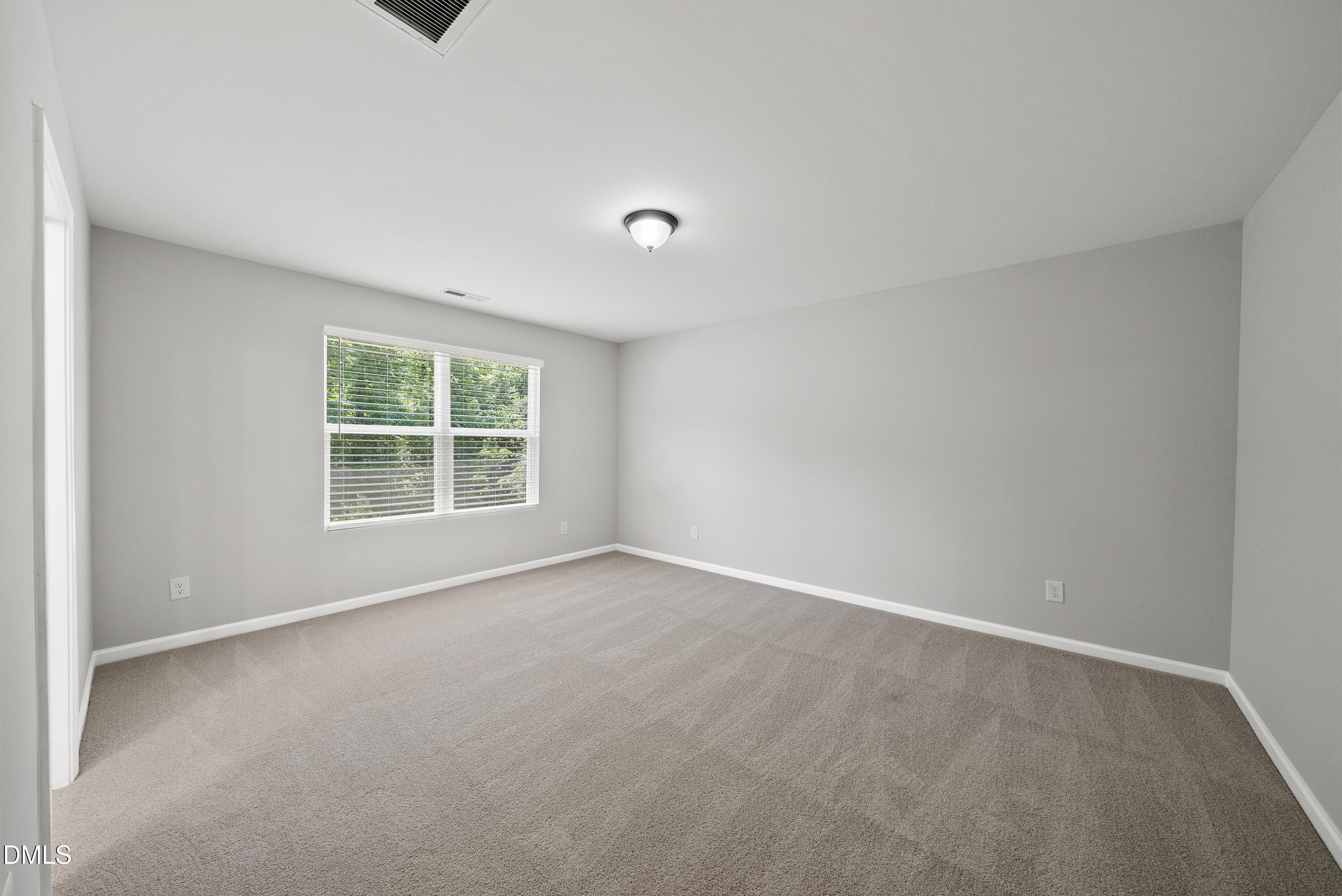 2816 Elsa Drive Raleigh, NC 27610 - Photo 24 of 35 an empty room with a window