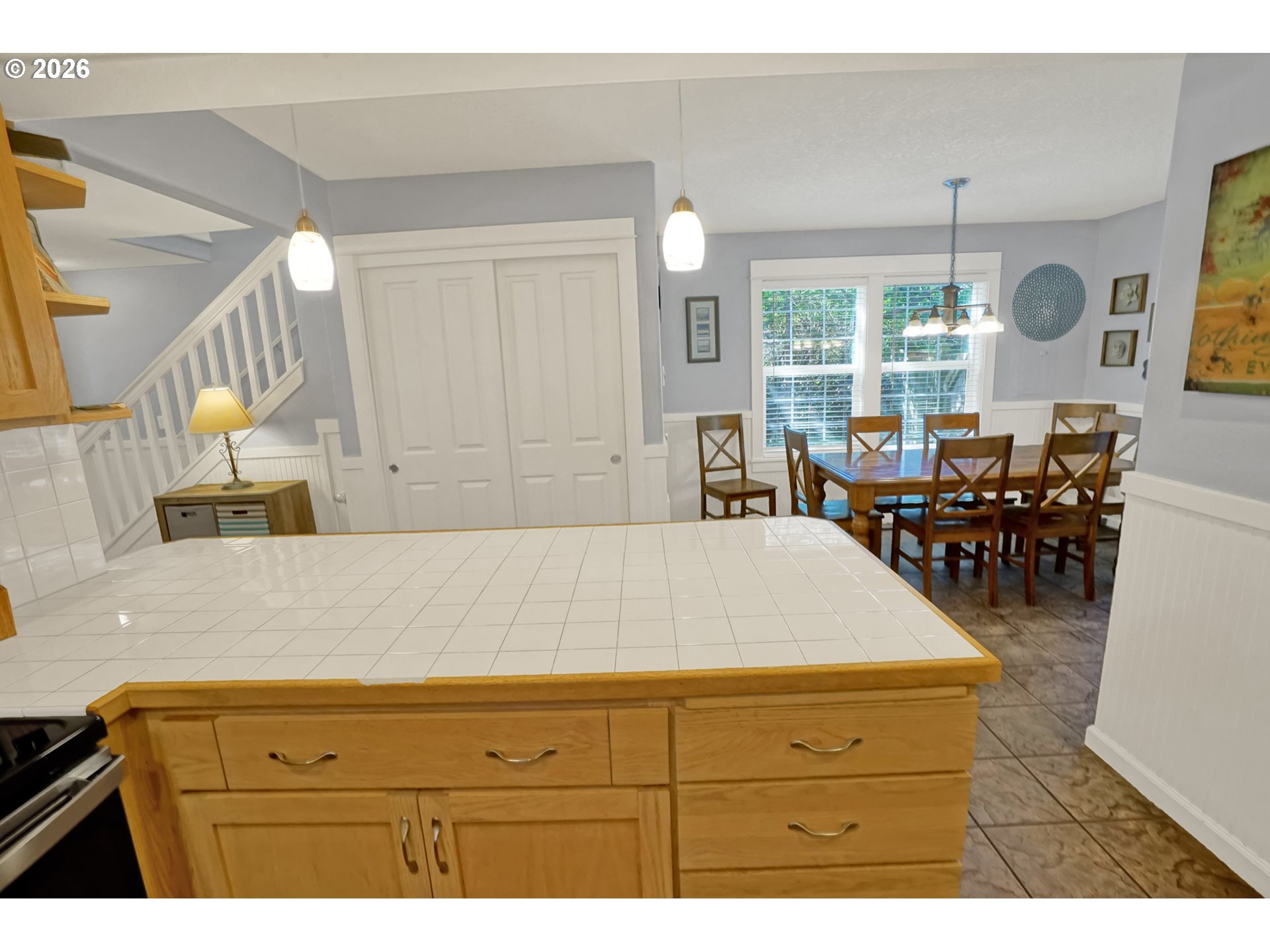 265 Bunchberry Way Depoe Bay, OR 97341 - Photo 12 of 48 a living room with couches and kitchen view with wooden floor