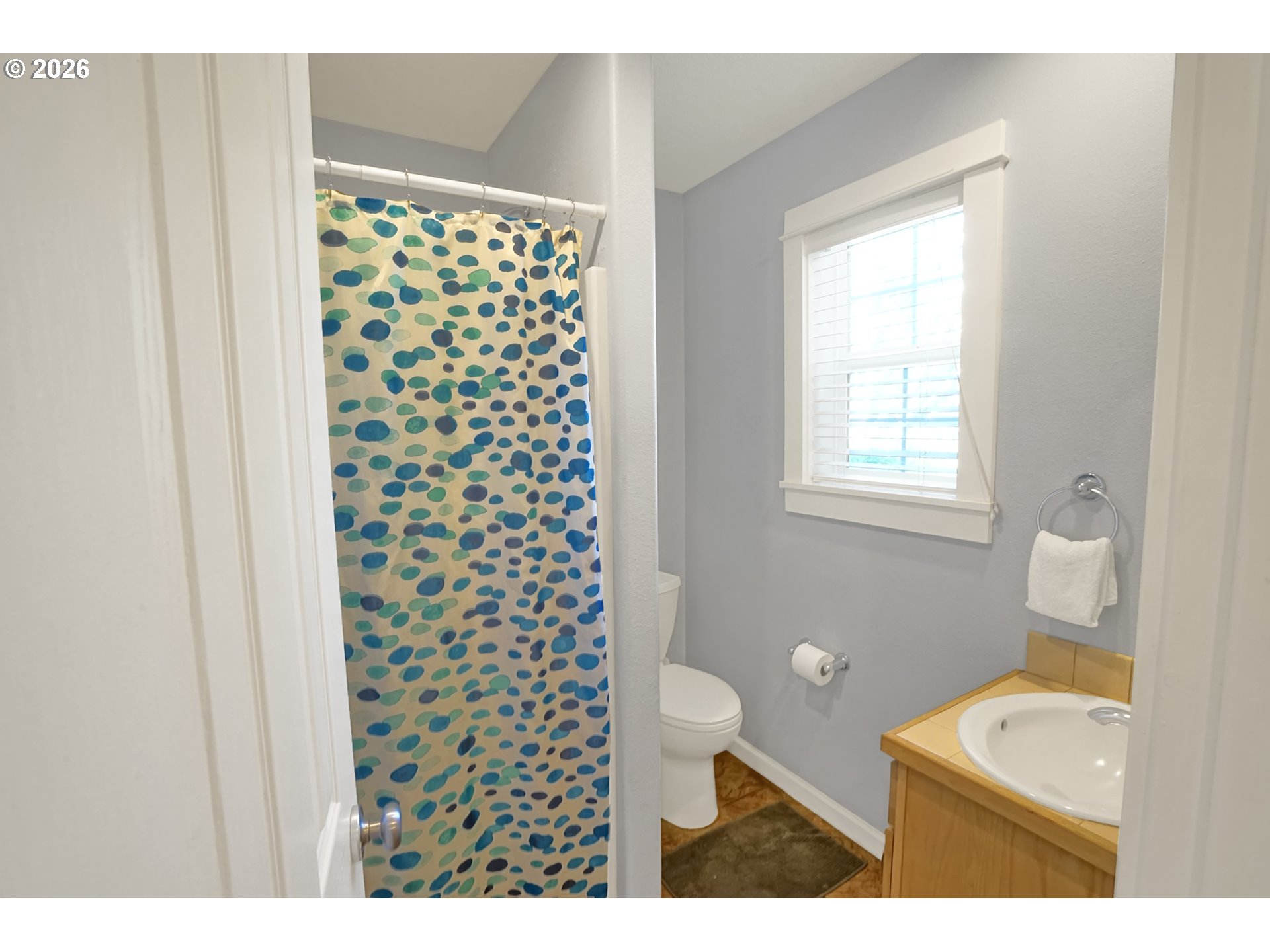 265 Bunchberry Way Depoe Bay, OR 97341 - Photo 15 of 48 a bathroom with a toilet a sink and a window