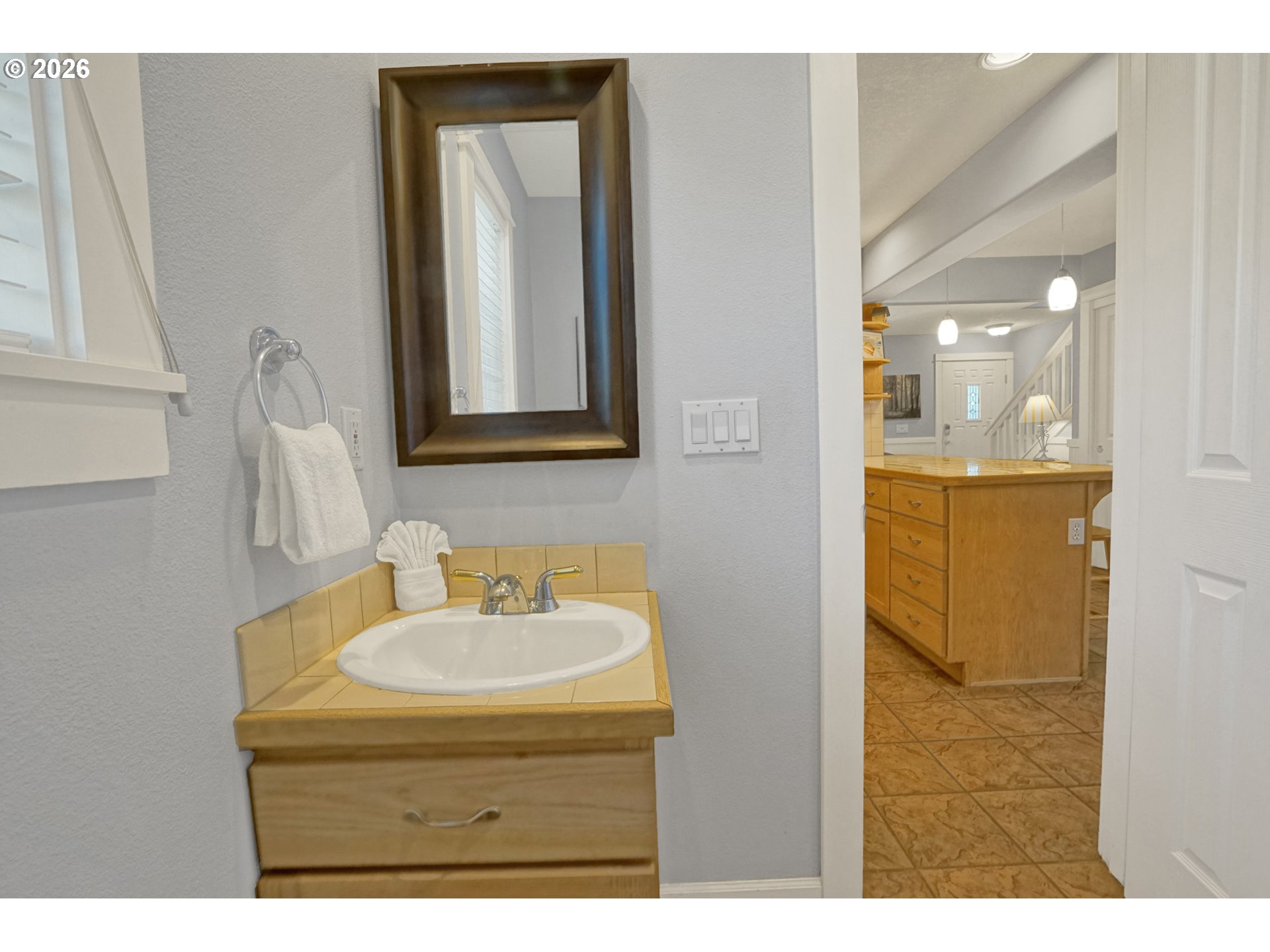 265 Bunchberry Way Depoe Bay, OR 97341 - Photo 16 of 48 a bathroom with a sink a mirror and shower