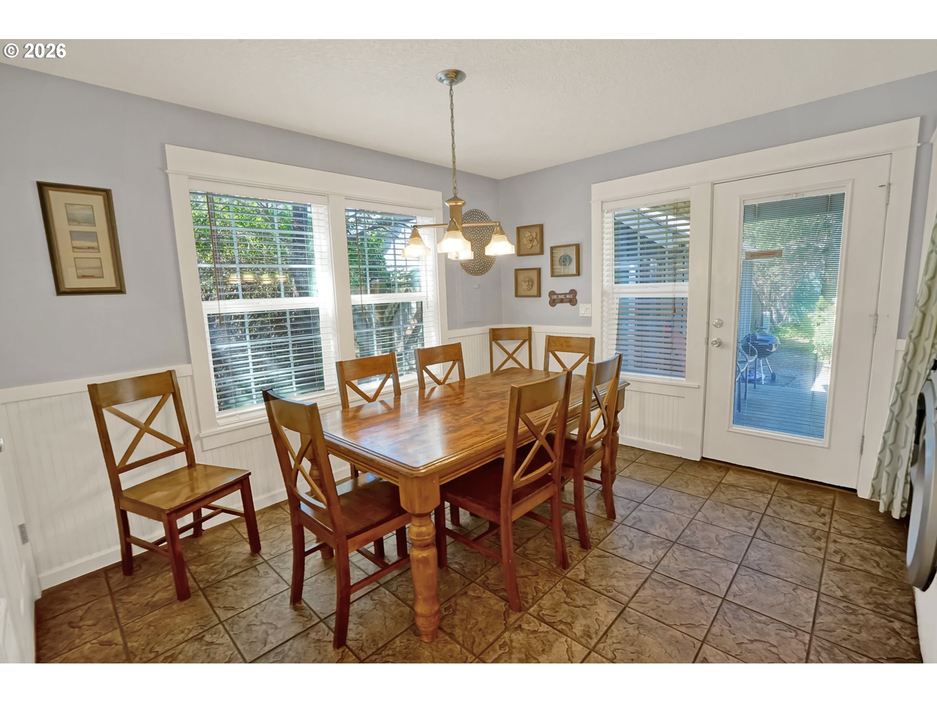 265 Bunchberry Way Depoe Bay, OR 97341 - Photo 17 of 48 a view of a dining room and livingroom with furniture window and wooden floor