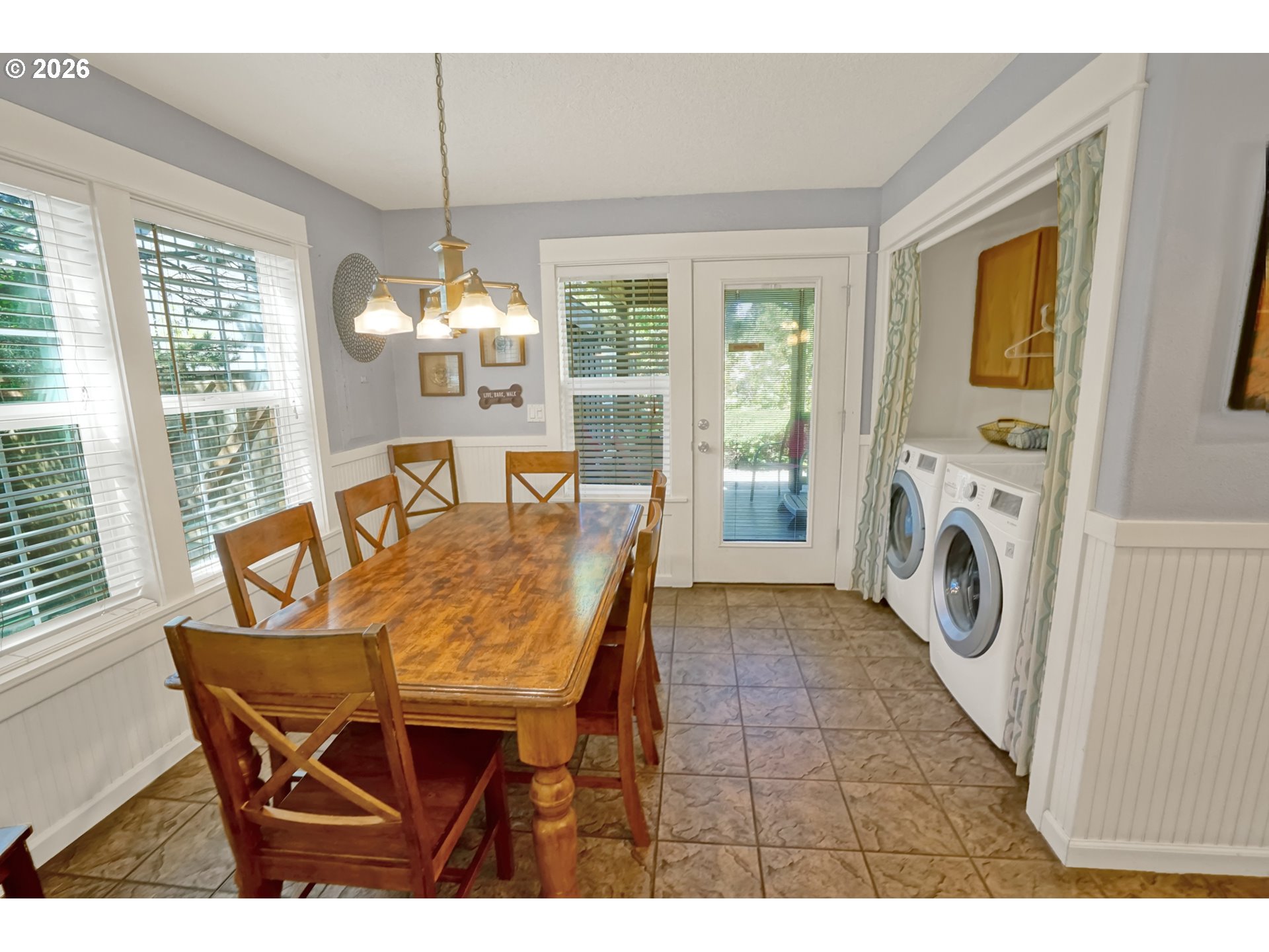 265 Bunchberry Way Depoe Bay, OR 97341 - Photo 18 of 48 a dining room with furniture a fireplace and large windows