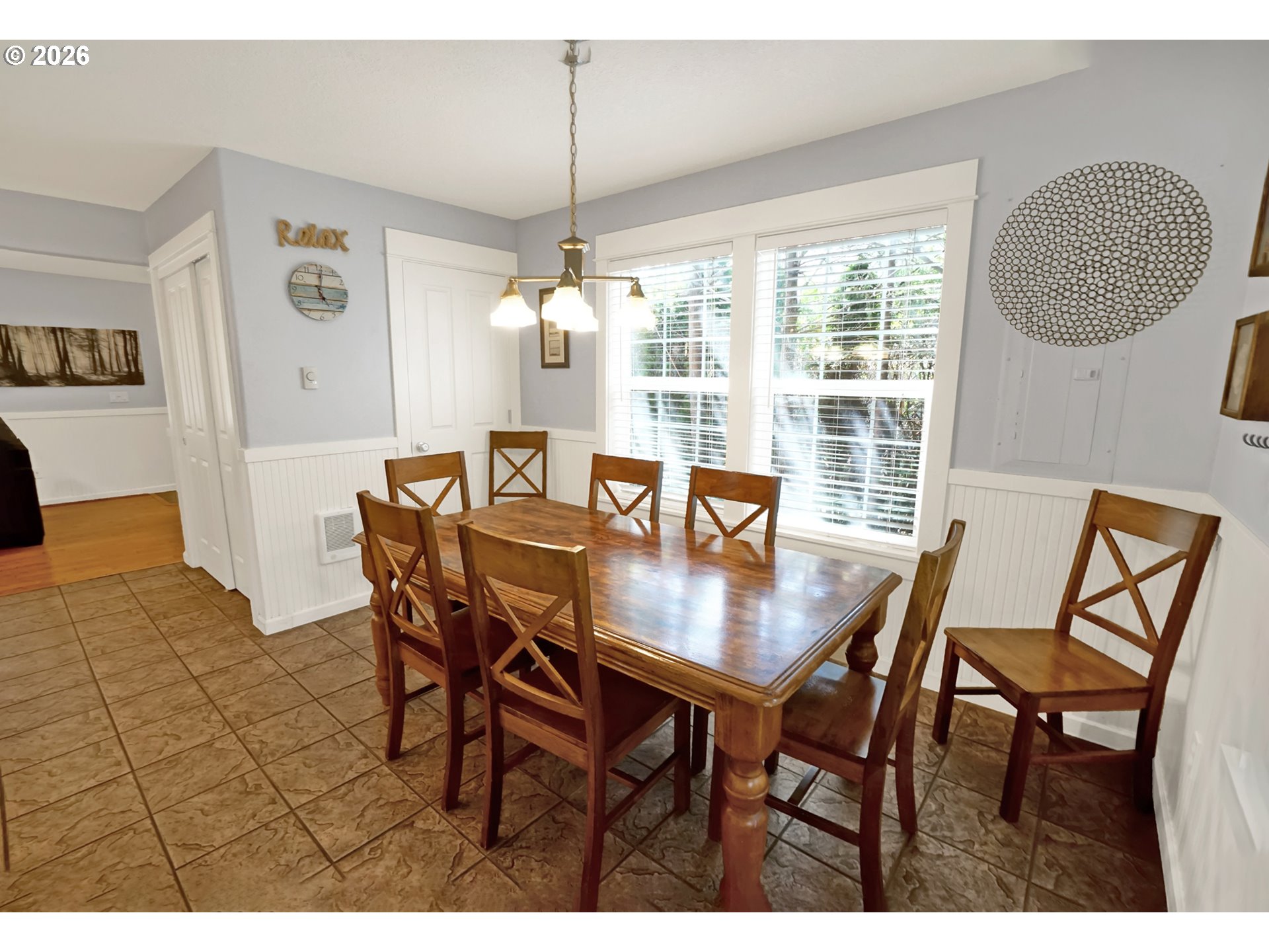 265 Bunchberry Way Depoe Bay, OR 97341 - Photo 20 of 48 a view of a dining room with furniture and chandelier