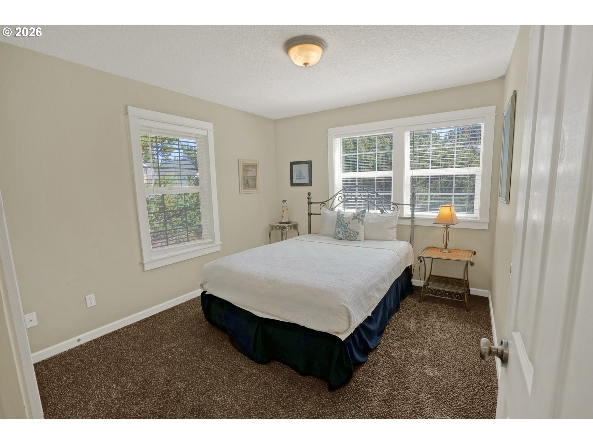 265 Bunchberry Way Depoe Bay, OR 97341 - Photo 23 of 48 a bedroom with a bed and a window