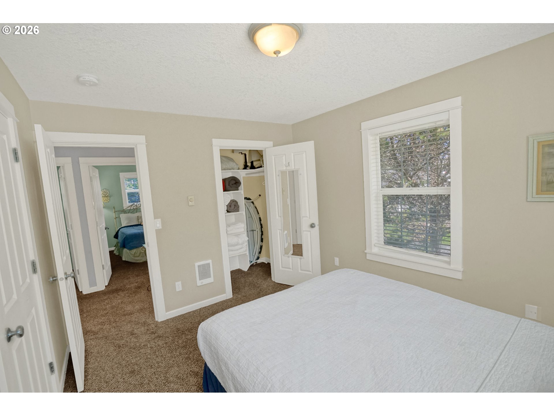 265 Bunchberry Way Depoe Bay, OR 97341 - Photo 24 of 48 a bedroom with a bed and a window
