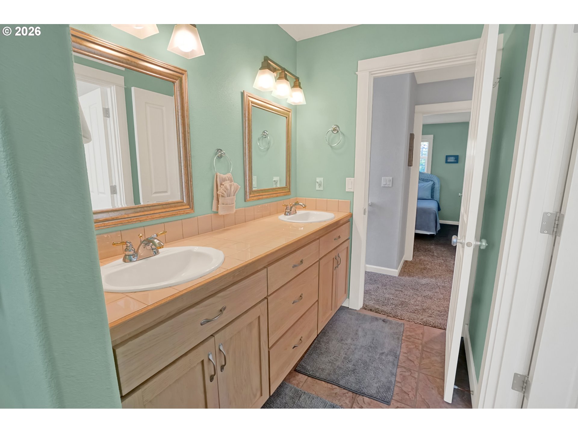 265 Bunchberry Way Depoe Bay, OR 97341 - Photo 28 of 48 a bathroom with a sink a vanity and a mirror