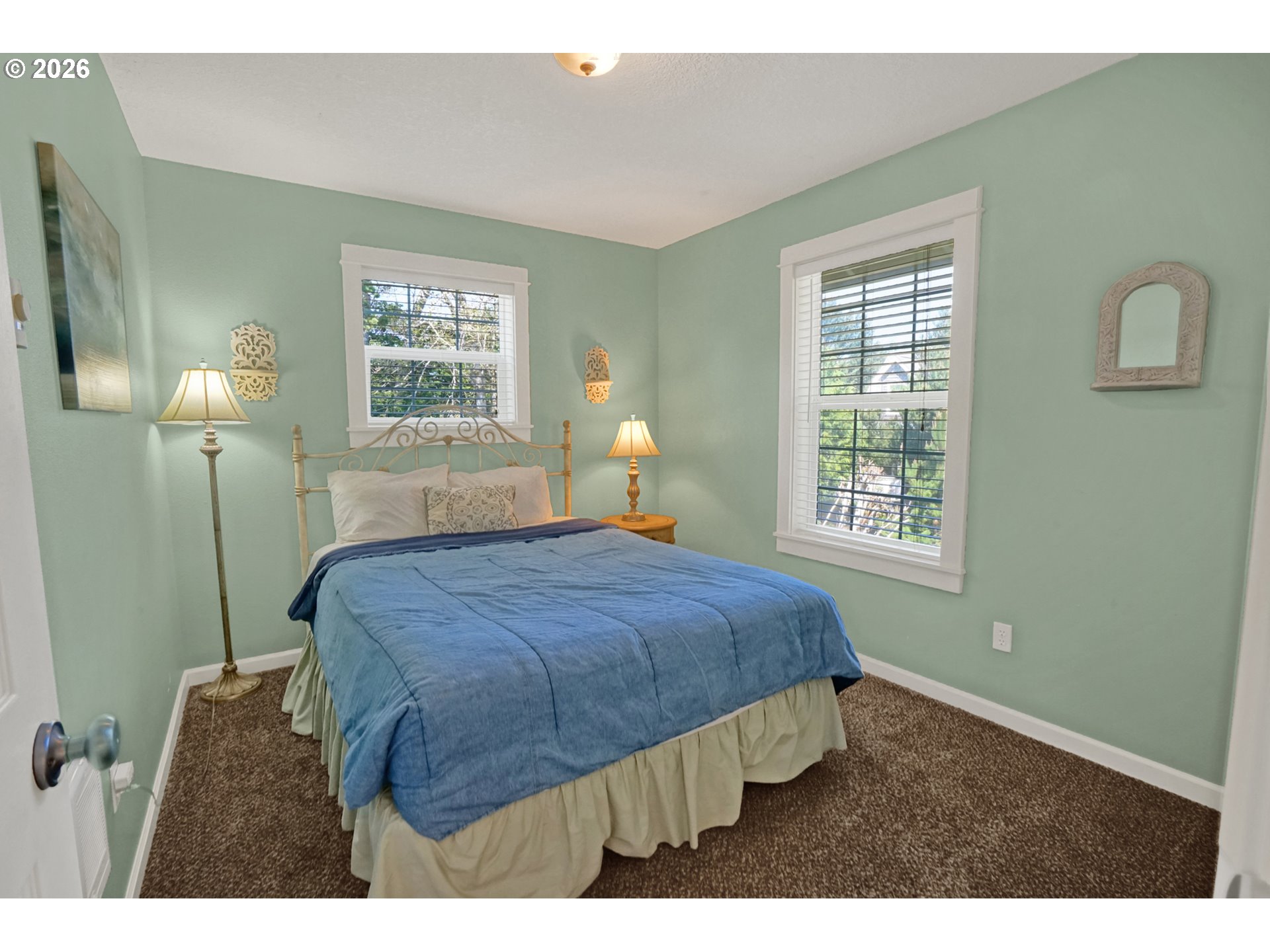 265 Bunchberry Way Depoe Bay, OR 97341 - Photo 30 of 48 a bedroom with a bed window and a wall painting