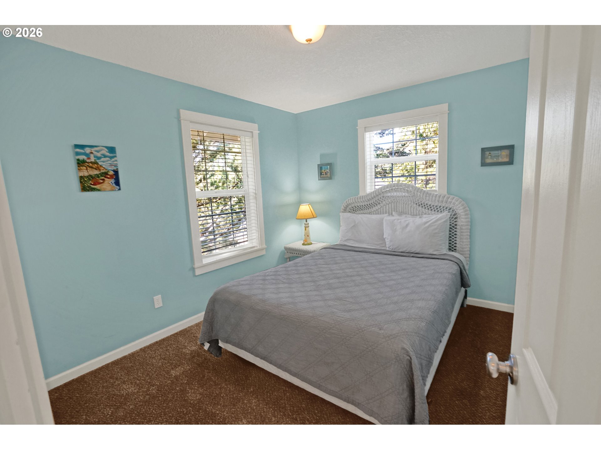 265 Bunchberry Way Depoe Bay, OR 97341 - Photo 32 of 48 a bedroom with a bed and a night stand