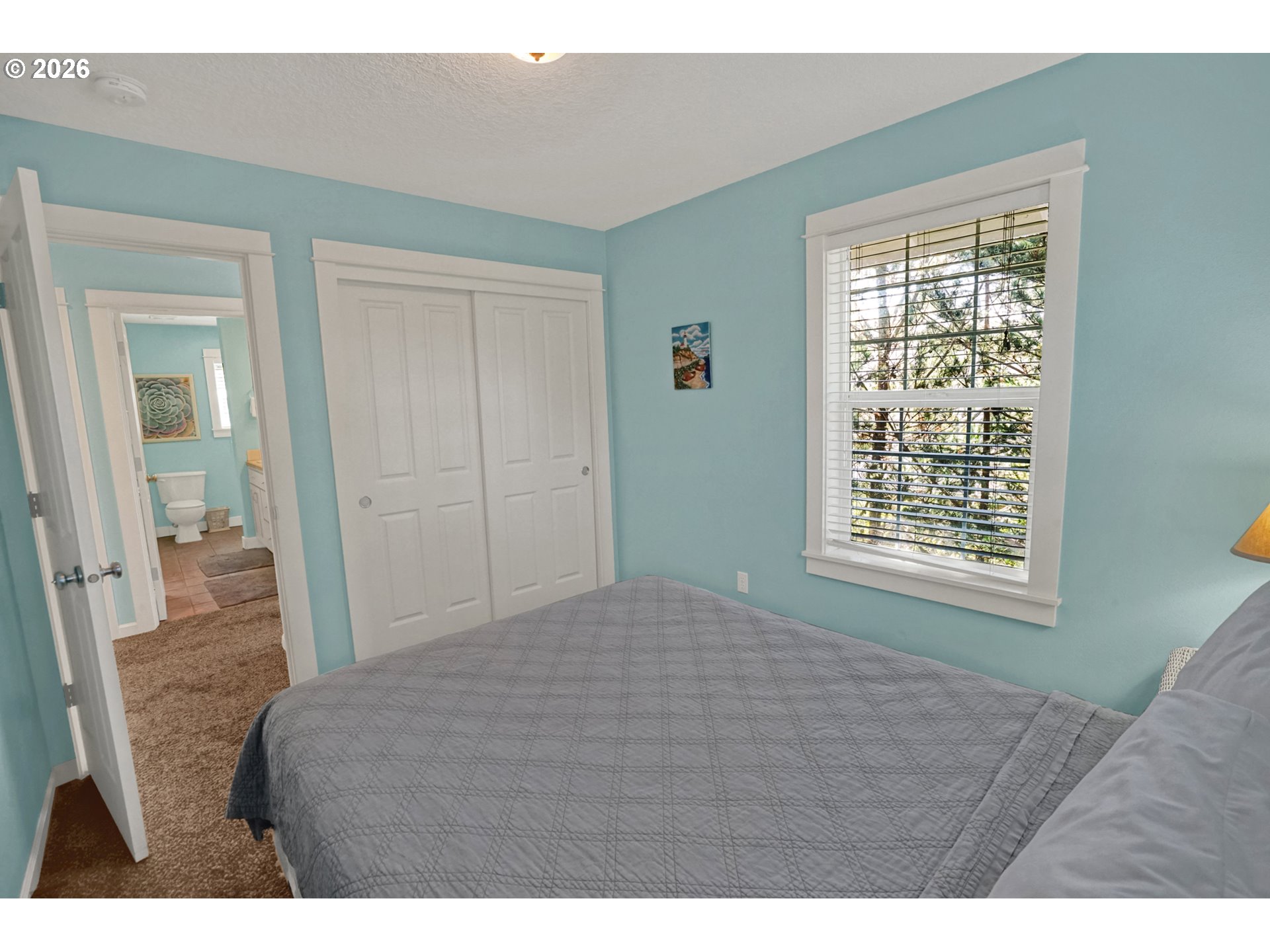 265 Bunchberry Way Depoe Bay, OR 97341 - Photo 33 of 48 a bedroom with a bed and a window