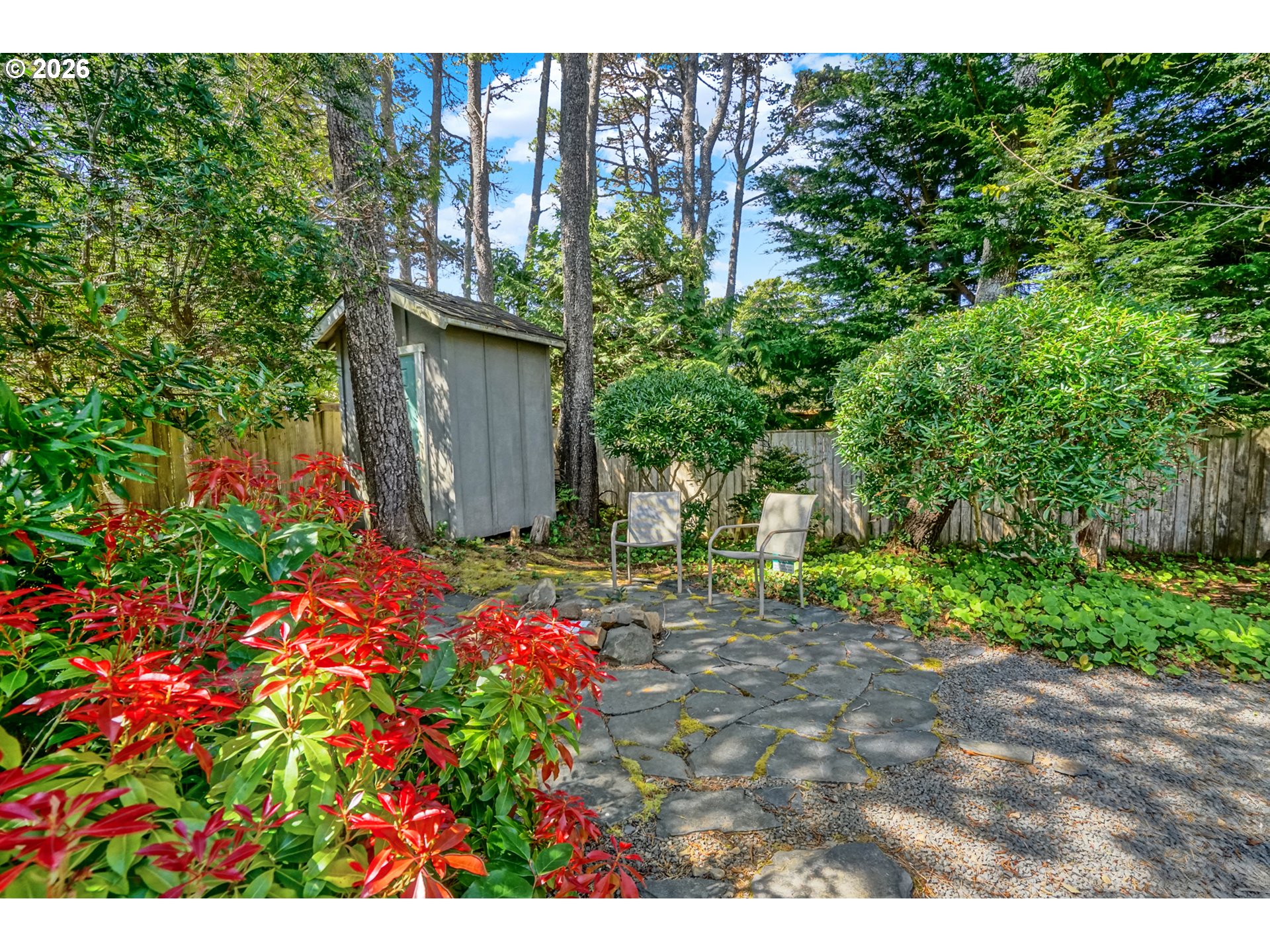 265 Bunchberry Way Depoe Bay, OR 97341 - Photo 40 of 48 a backyard of a house with lots of green space