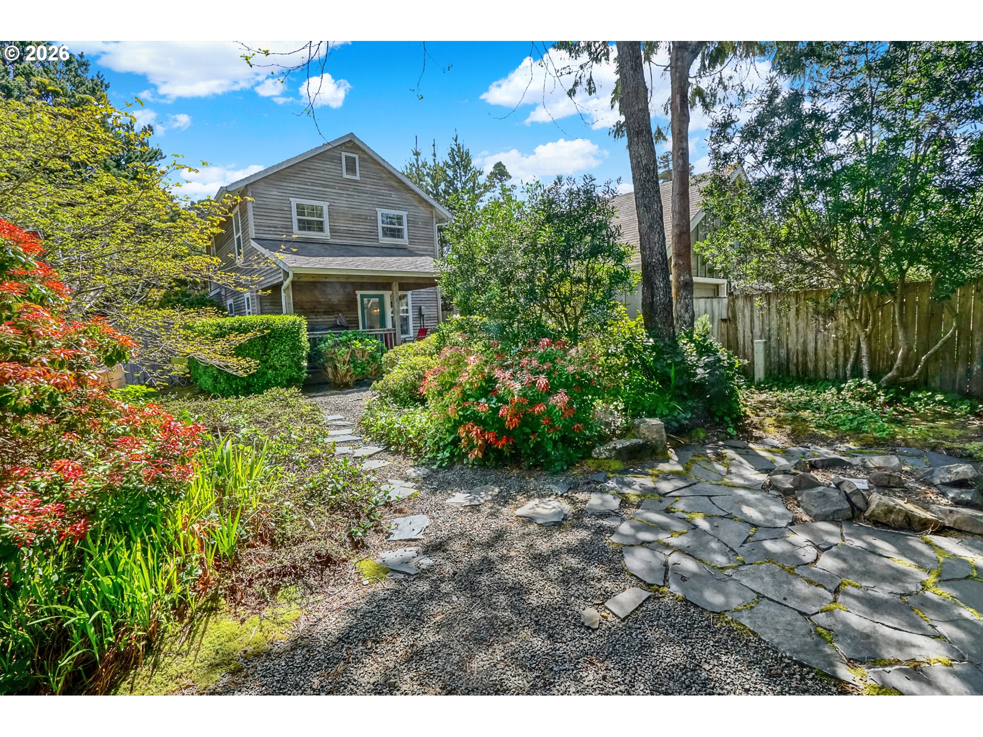 265 Bunchberry Way Depoe Bay, OR 97341 - Photo 41 of 48 a front view of a house with garden