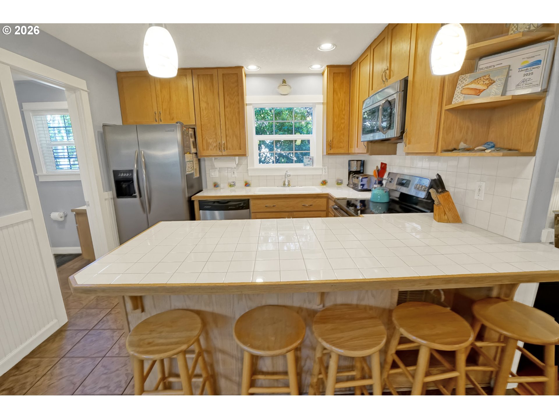 265 Bunchberry Way Depoe Bay, OR 97341 - Photo 9 of 48 a dining table with chairs and window