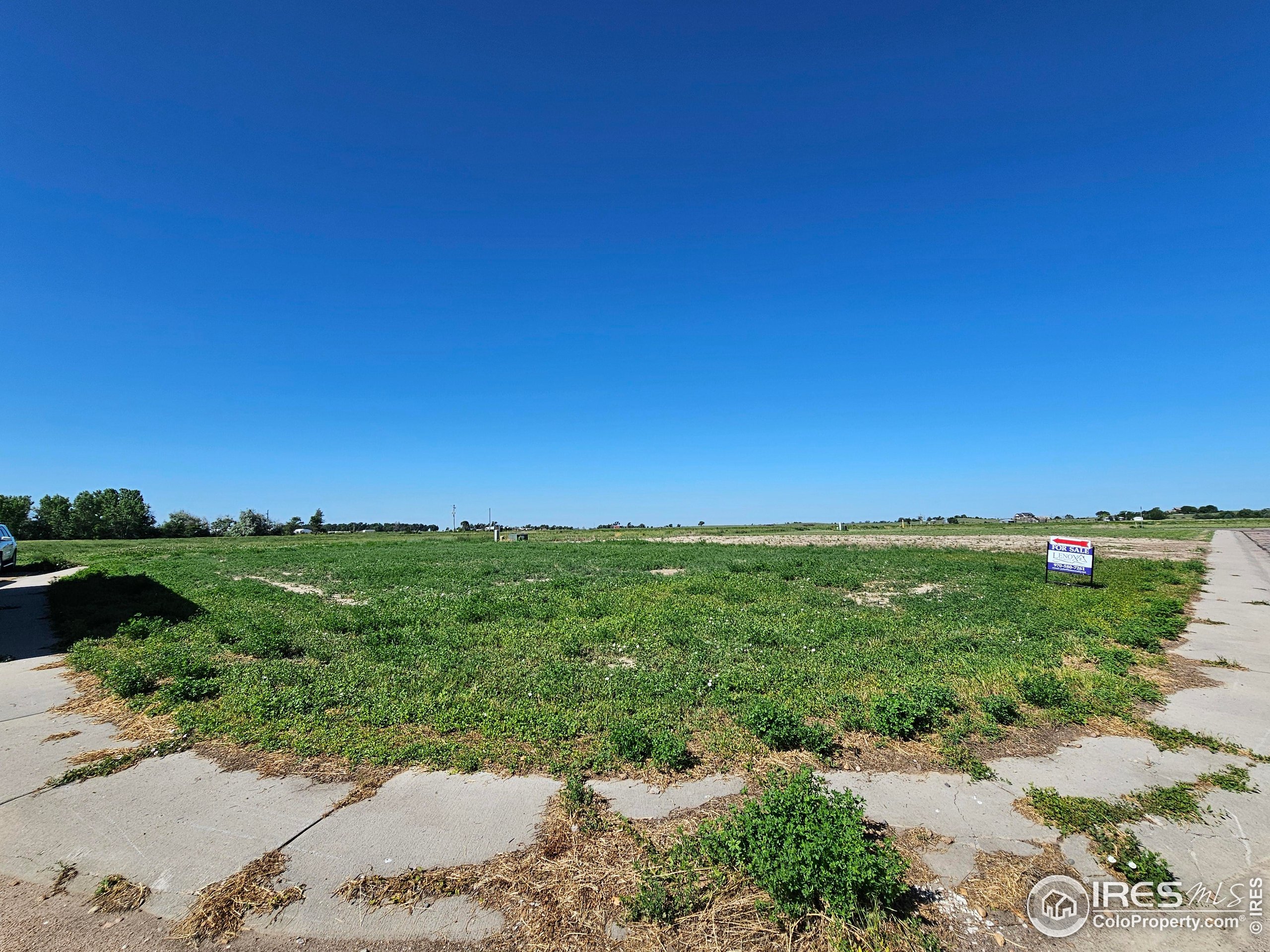 829 Nicole Road Sterling, CO 80751 - Photo 13 of 14 a view of a field with an ocean