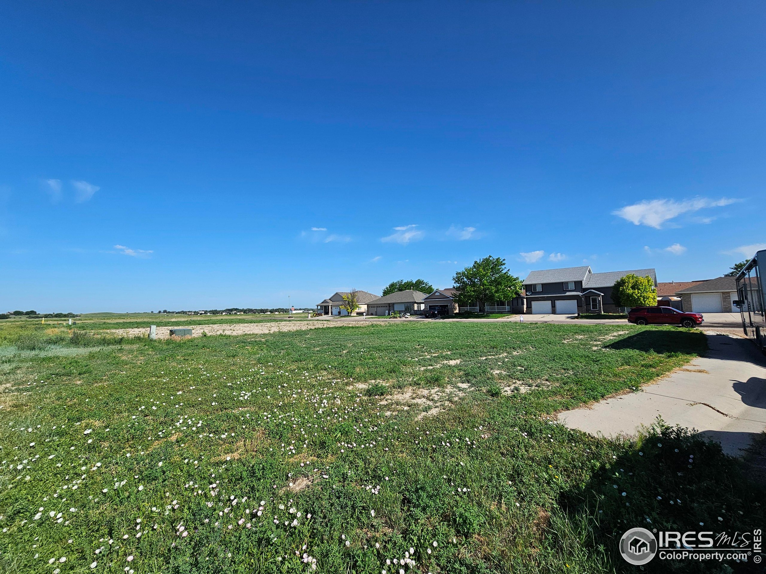 829 Nicole Road Sterling, CO 80751 - Photo 3 of 14 a view of a street with a building in the background