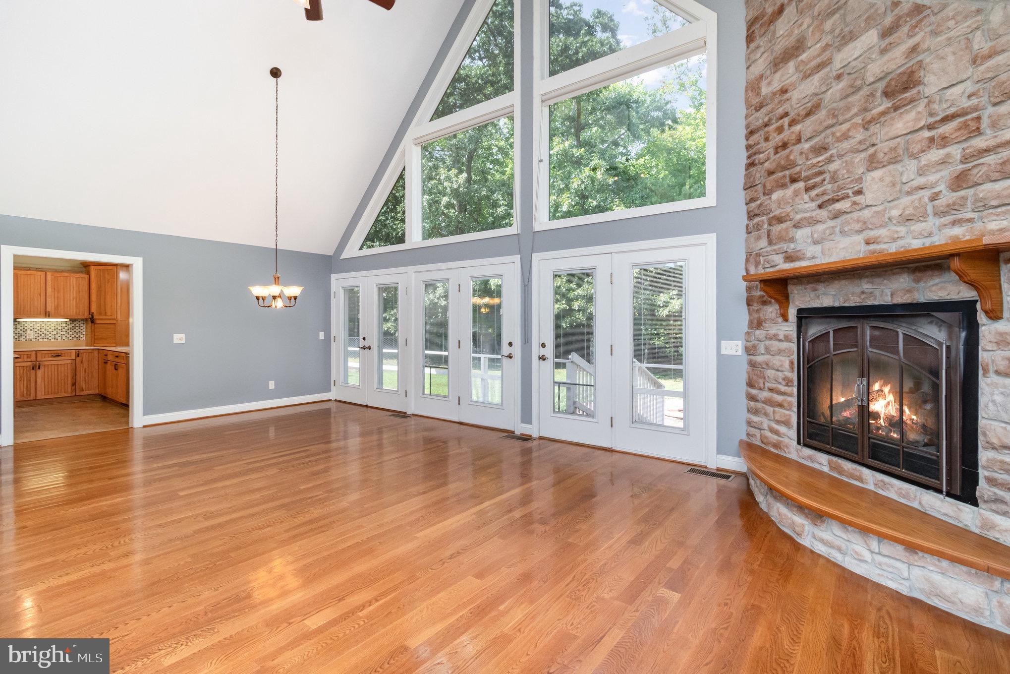 687 Prospect Hill Road Montross, VA 22520 - Photo 11 of 80 a view of an empty room with wooden floor and a window