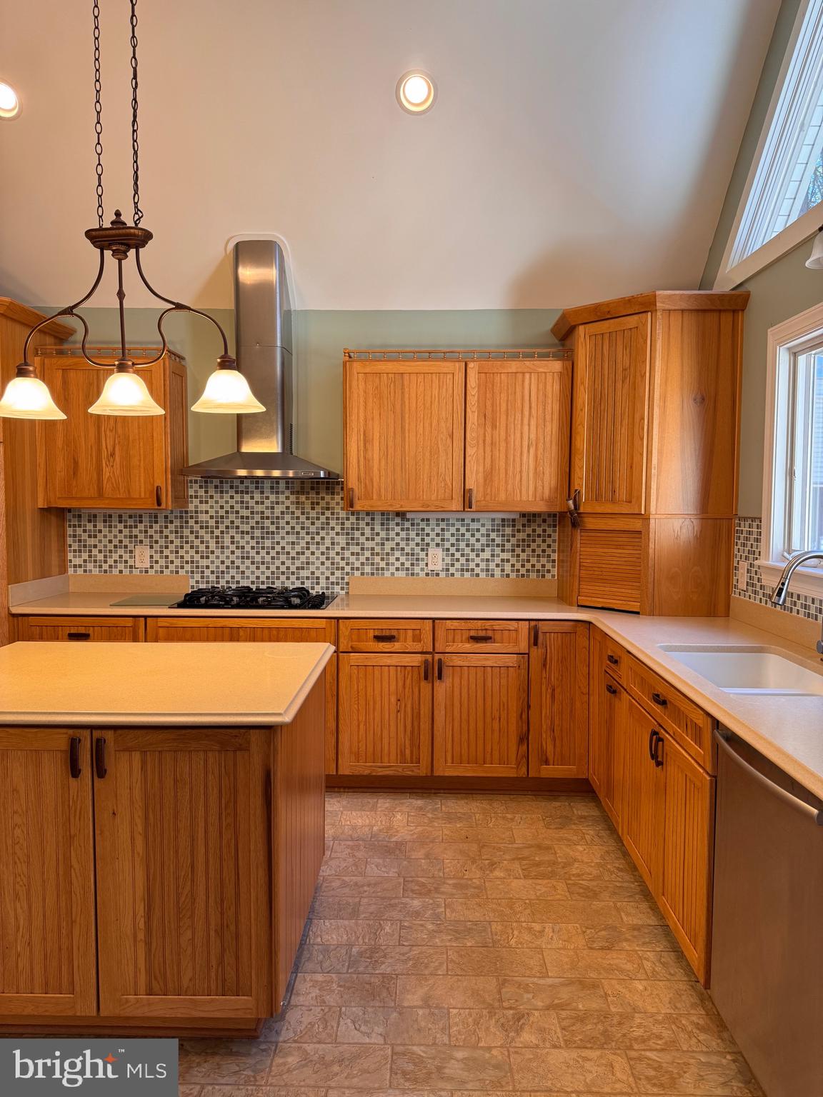 687 Prospect Hill Road Montross, VA 22520 - Photo 20 of 80 a large kitchen with stainless steel appliances granite countertop wooden cabinets a sink and dishwasher