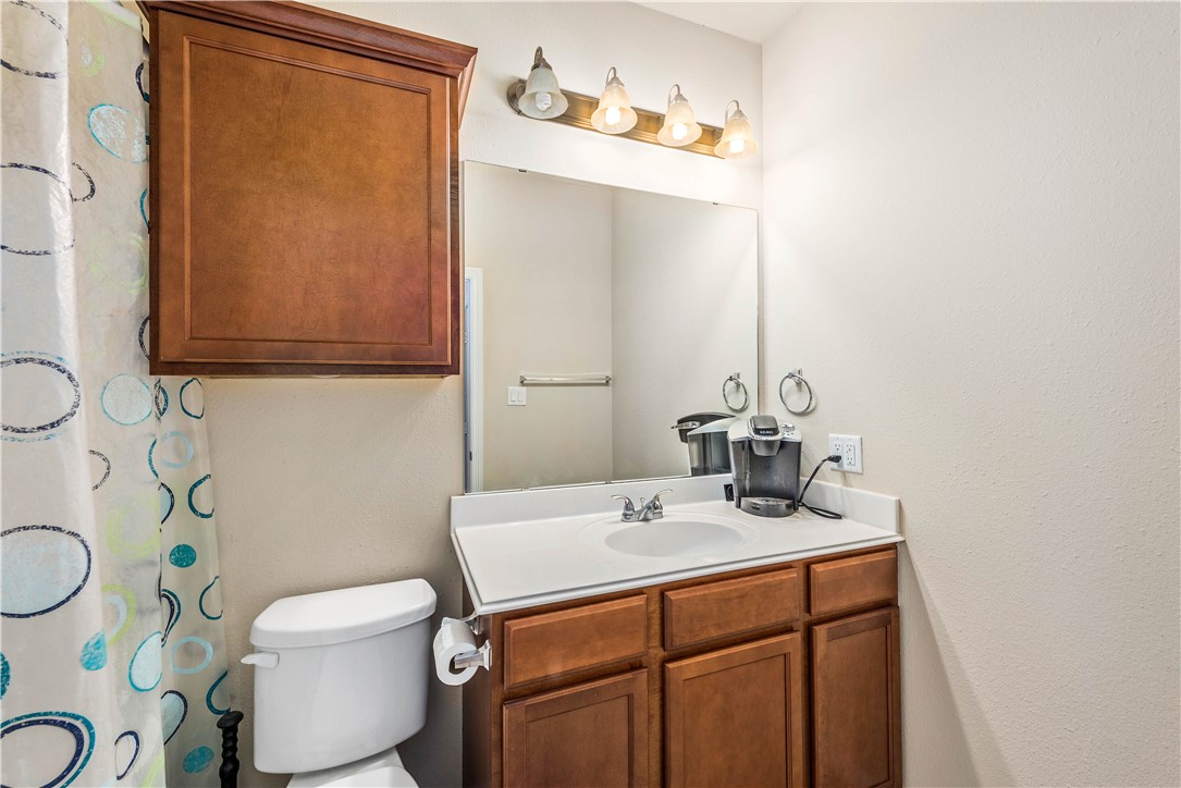1198 Jones-Butler Road, Unit 1706 College Station, TX 77840 - Photo 7 of 15 a bathroom with a sink a toilet and mirror