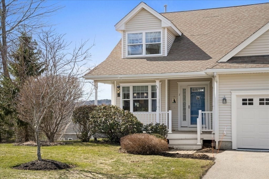 7 Primmett Lane, Unit 7 Worcester, MA 01609 - Photo 1 of 38 a front view of a house with a yard