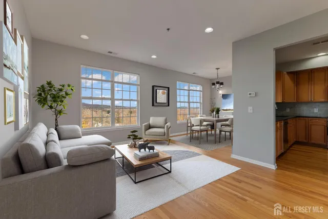 a kitchen with stainless steel appliances granite countertop a stove a refrigerator and a microwave