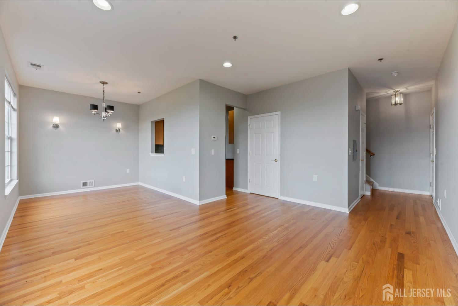 142 Conover Terrace Lebanon, NJ 08833 - Photo 7 of 33 a view of an empty room with wooden floor and a bathroom