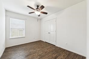 4910 Pacific Ridge Lane Rosenberg, TX 77469 - Photo 11 of 14 a view of a livingroom with a ceiling fan & windows