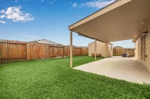 4910 Pacific Ridge Lane Rosenberg, TX 77469 - Photo 13 of 14 a view of a back yard of the house
