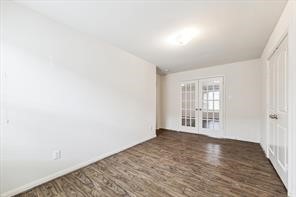 4910 Pacific Ridge Lane Rosenberg, TX 77469 - Photo 2 of 14 a view of an empty room with wooden floor and a window