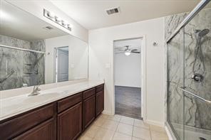 4910 Pacific Ridge Lane Rosenberg, TX 77469 - Photo 8 of 14 a bathroom with a double vanity sink mirror and shower