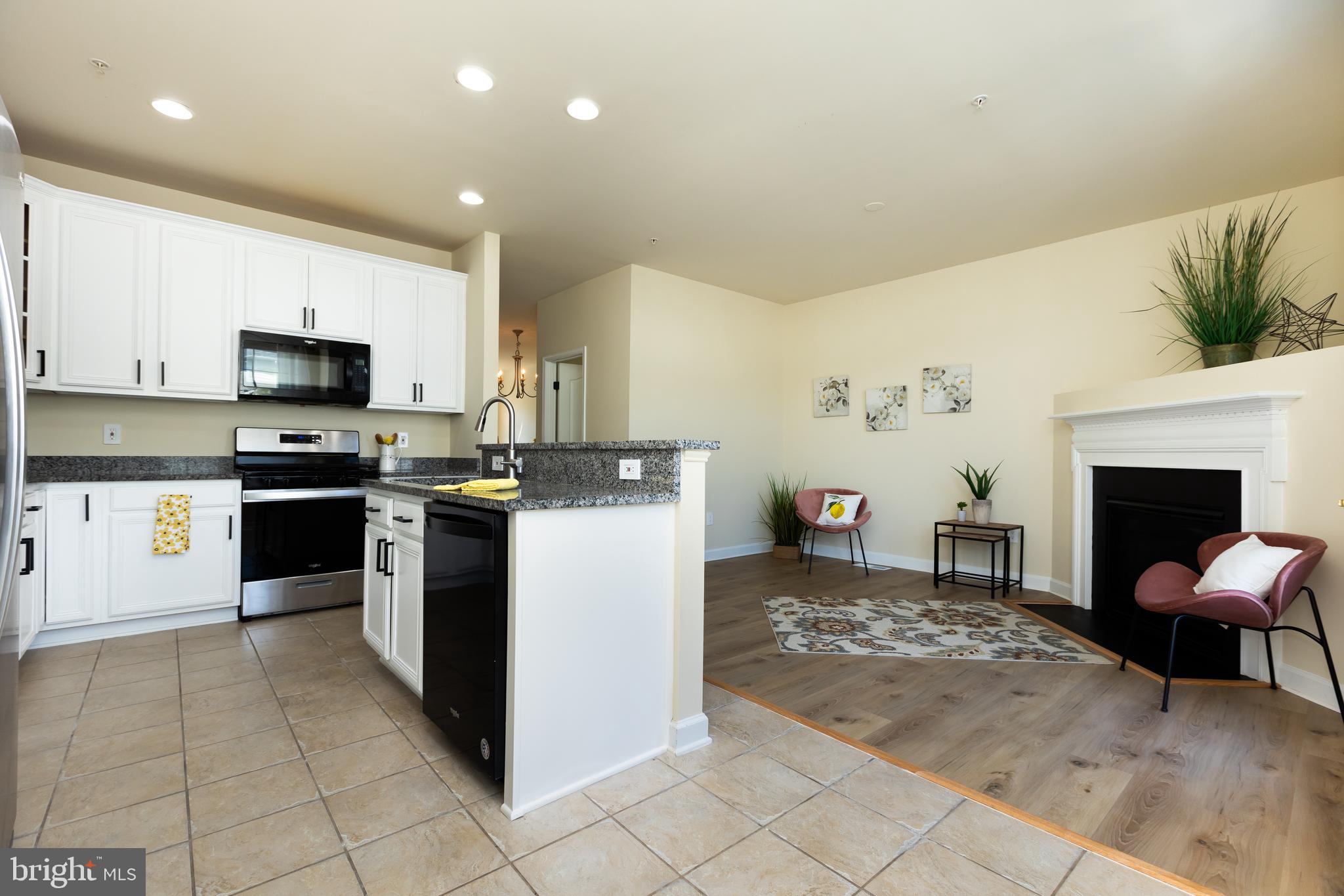 637 Spectator Avenue Landover, MD 20785 - Photo 15 of 54 a kitchen with a cabinets and a stove top oven