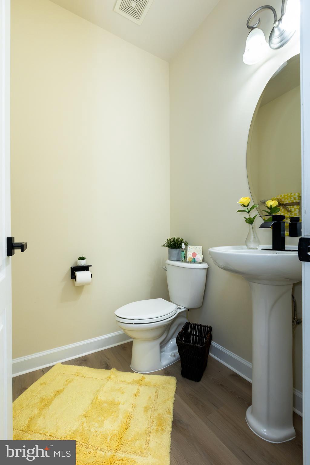 637 Spectator Avenue Landover, MD 20785 - Photo 20 of 54 a bathroom with a toilet and a mirror