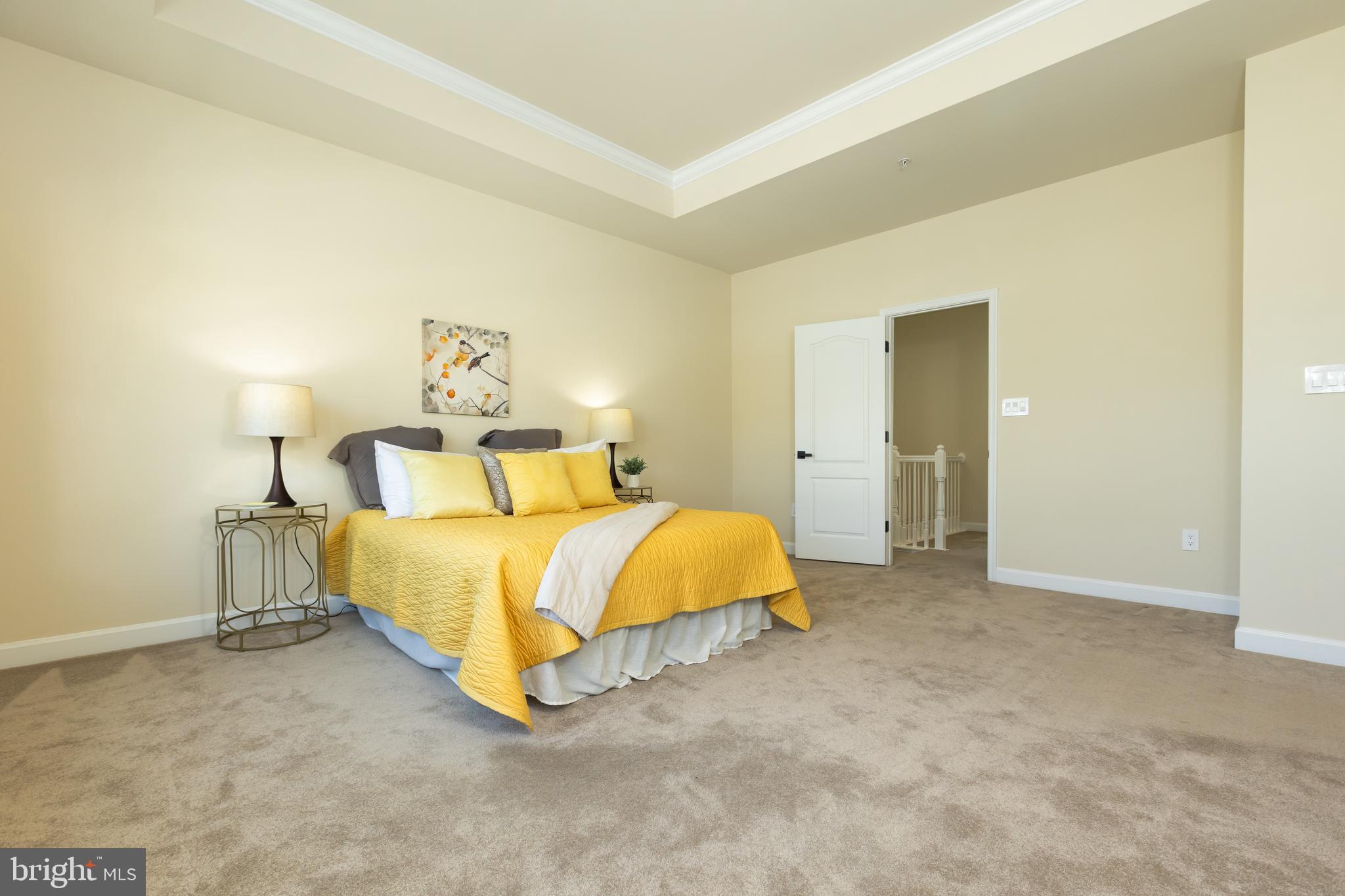 637 Spectator Avenue Landover, MD 20785 - Photo 26 of 54 a spacious bedroom with a bed and a lamp