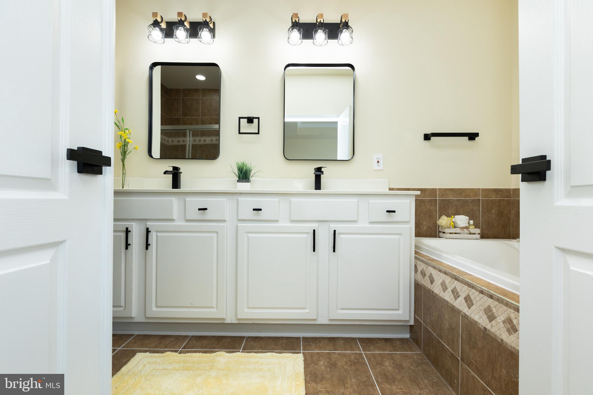 637 Spectator Avenue Landover, MD 20785 - Photo 27 of 54 a bathroom with a sink and a mirror