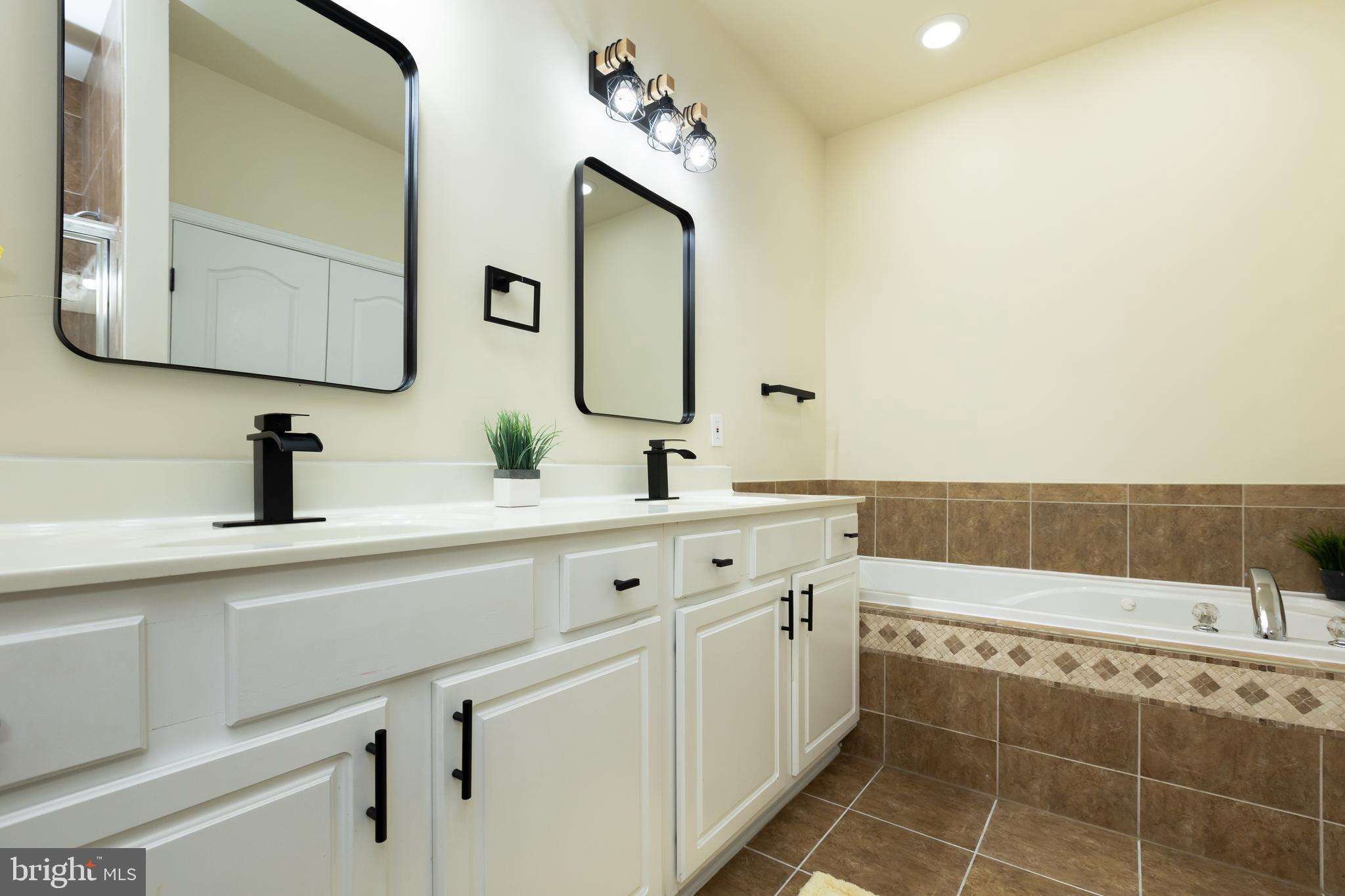 637 Spectator Avenue Landover, MD 20785 - Photo 28 of 54 a bathroom with a double vanity sink mirror and