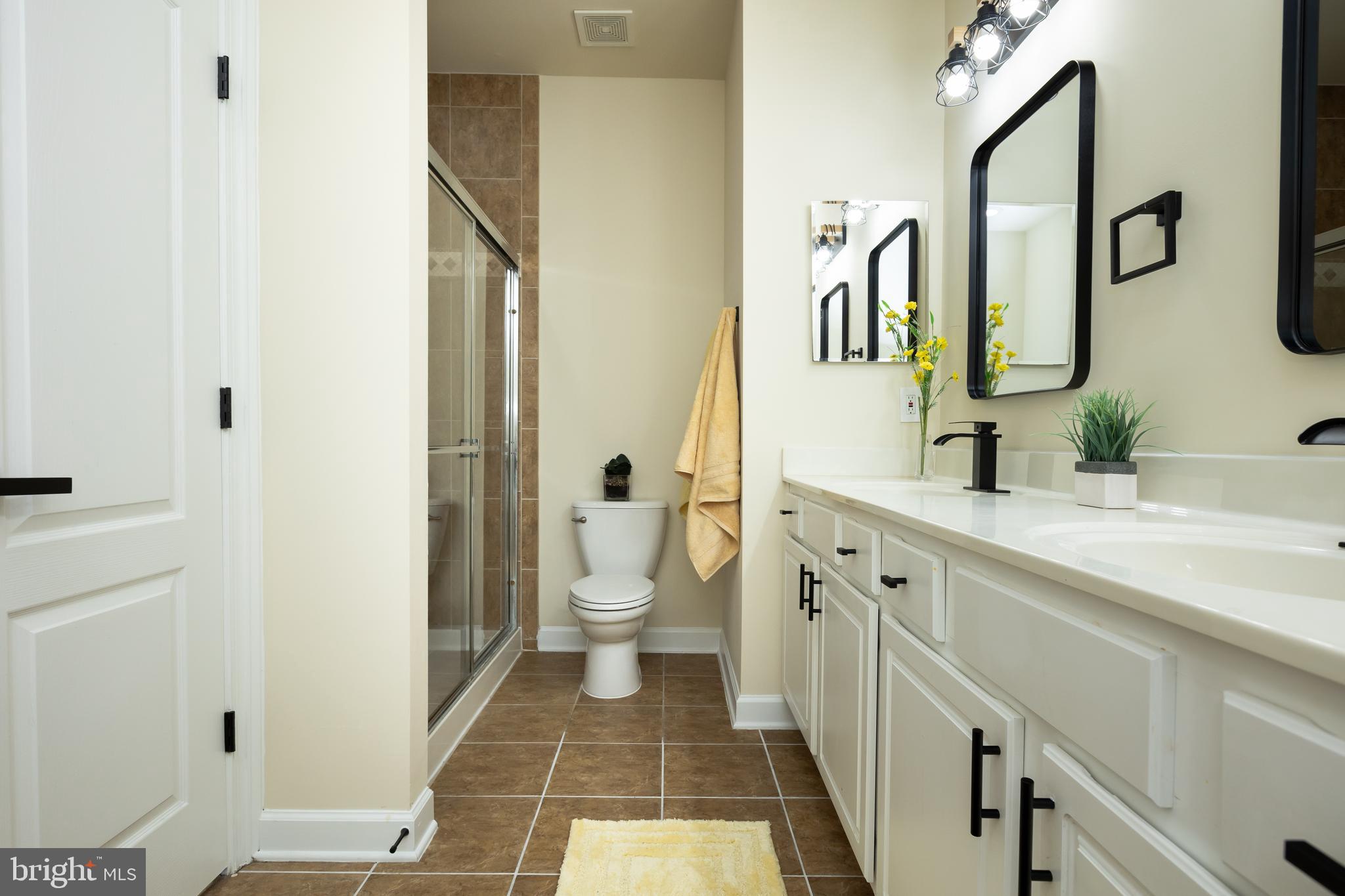 637 Spectator Avenue Landover, MD 20785 - Photo 29 of 54 a spacious bathroom with a double vanity sink and a mirror