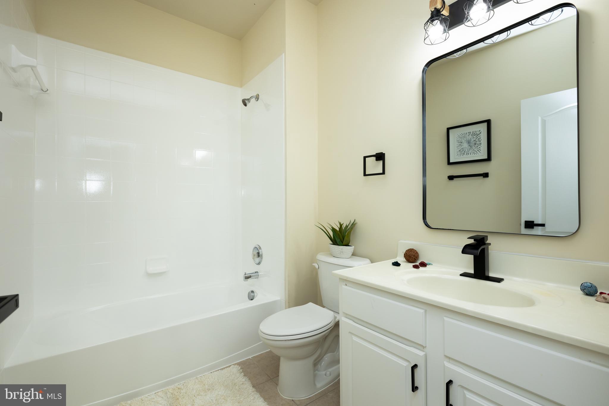 637 Spectator Avenue Landover, MD 20785 - Photo 34 of 54 a bathroom with a sink toilet and shower