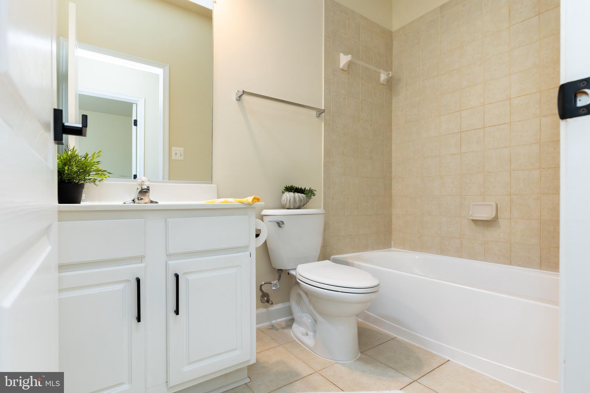 637 Spectator Avenue Landover, MD 20785 - Photo 40 of 54 a bathroom with a sink toilet vanity and shower